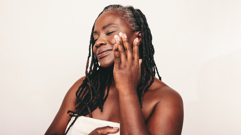 woman applying face cream