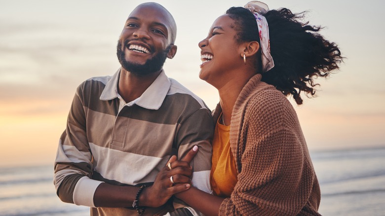 Couple smiling on the beach