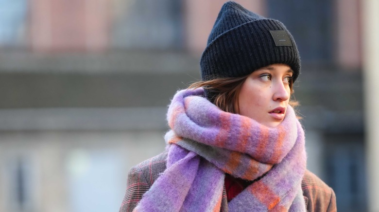 Woman in scarf and woolen beanie 