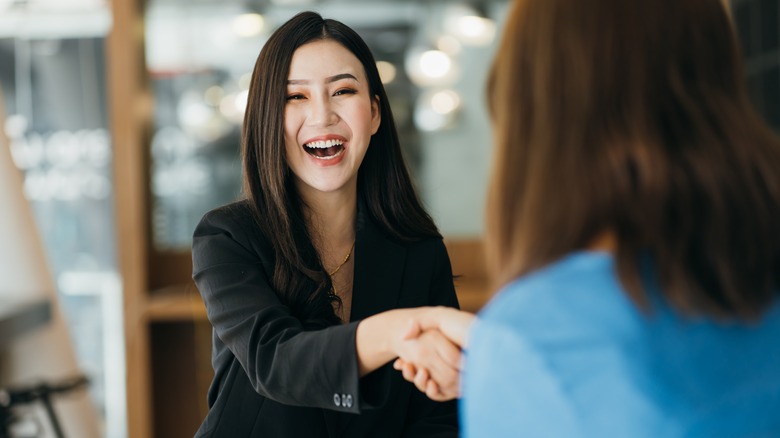 Job interviewer greeting a candidate