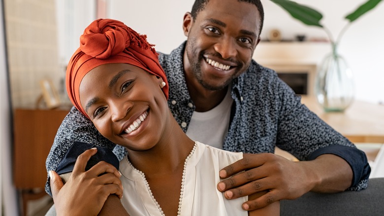 African American couple holding each other