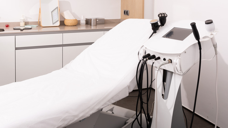 photo of a medical office with chair next to medical instruments