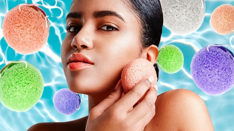 Woman cleaning face with konjac sponge