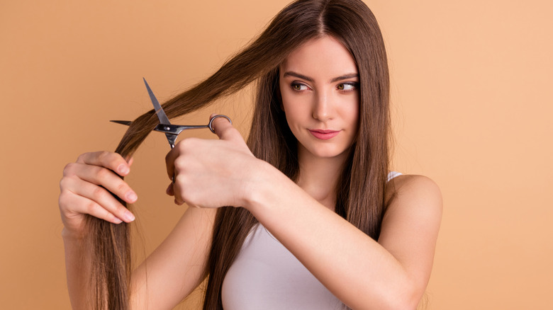A girl cutting her own hair