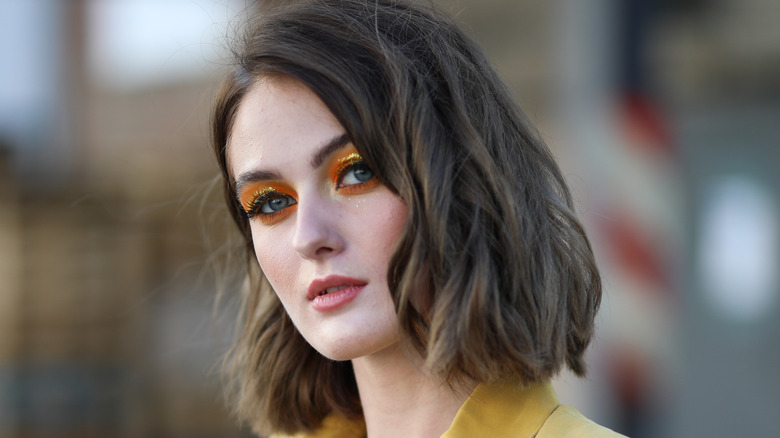 woman wearing orange eyeshadow