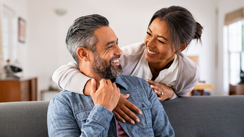 A smiling couple at home