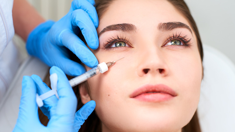 Woman getting under-eye filler