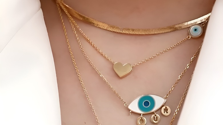 Woman wearing evil eye necklace