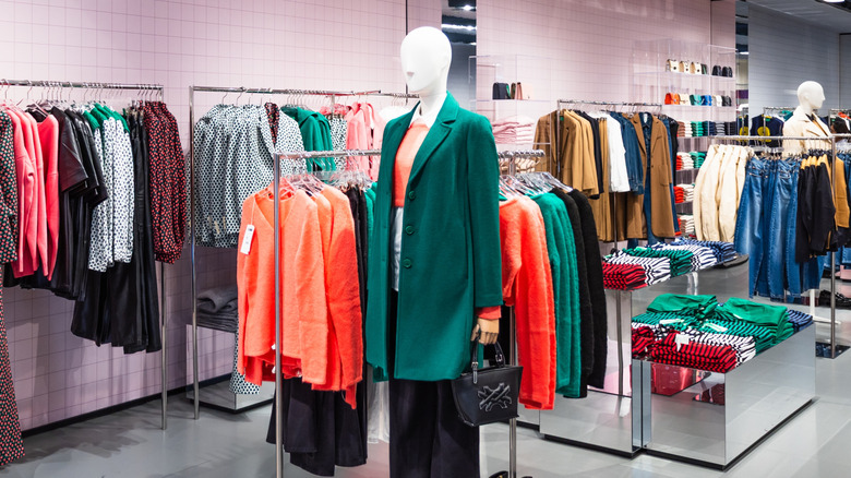 The interior of a Benetton clothing store featuring colorful fashion