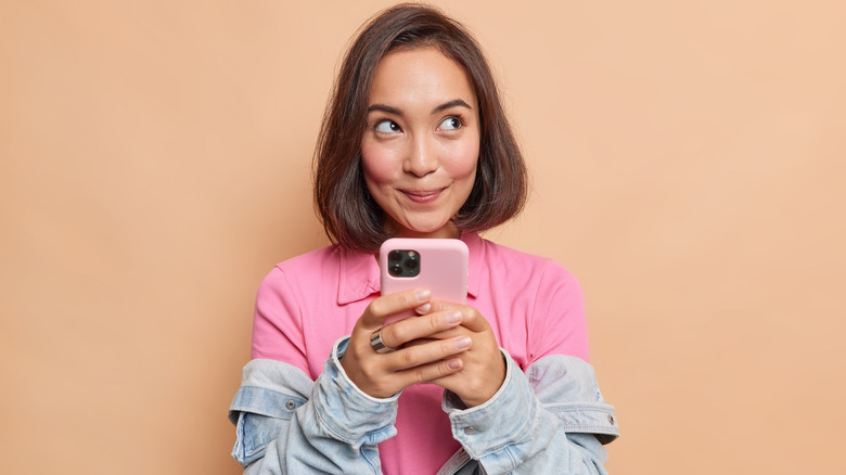 happy woman holding phone