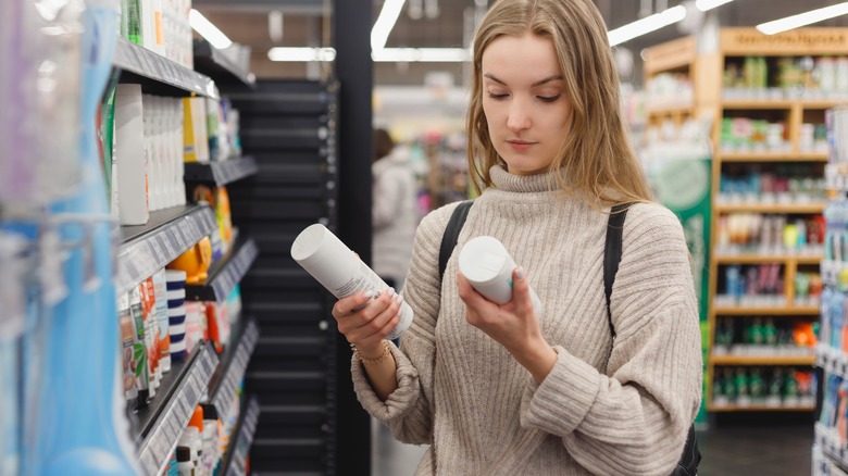 Woman comparing products 