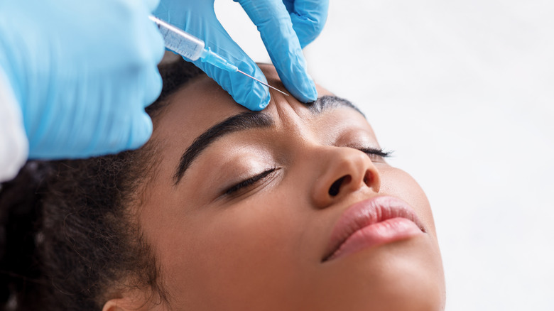 Woman receiving botox injections