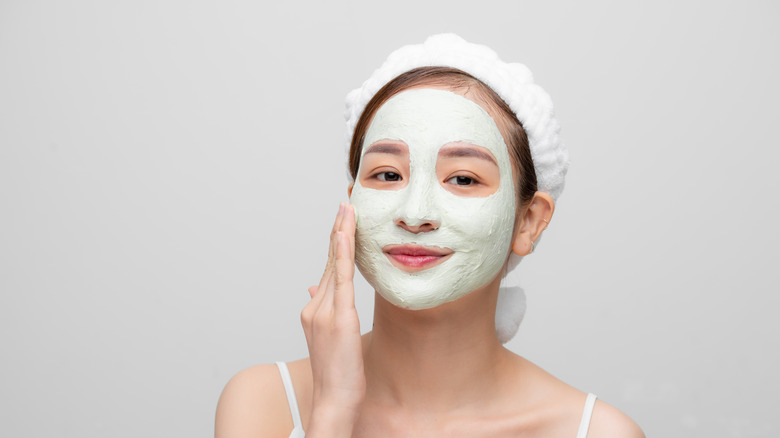 woman with clay mask on