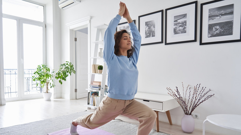 woman doing pilates in home
