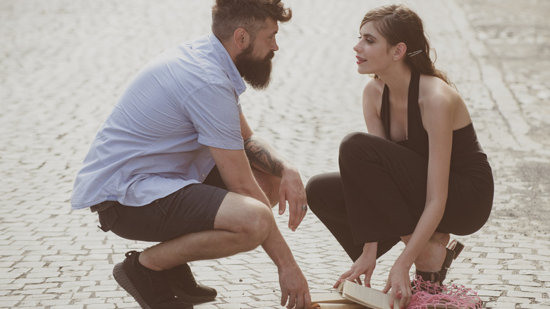 Man helping woman