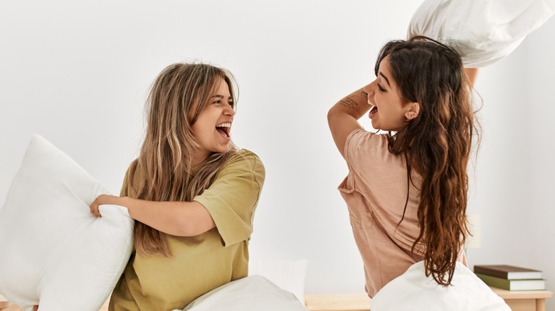 Women having a pillow fight