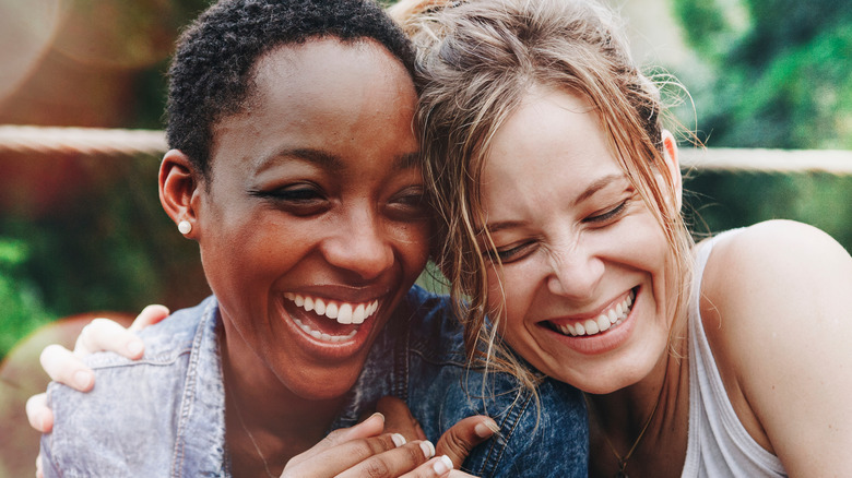 two women laughing together