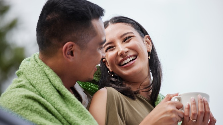 young asian couple smiling and laughing