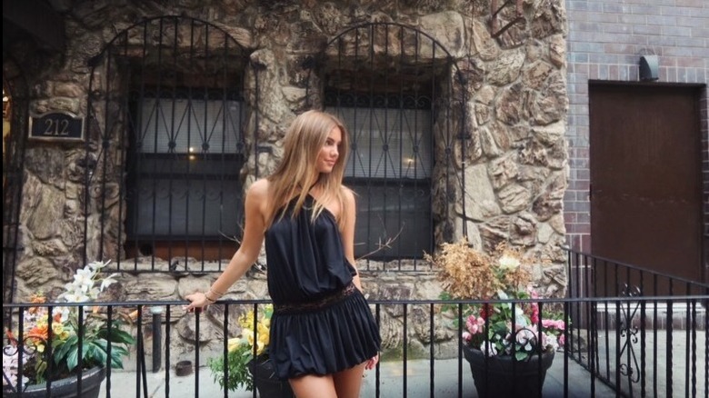Willow White wears a black mini dress in New York