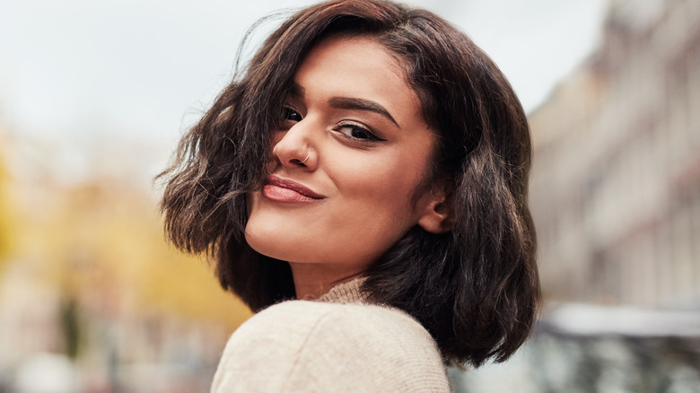 Woman with brunette hair smiling