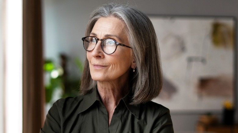 Smiling mature woman with a mid-length lob haircut