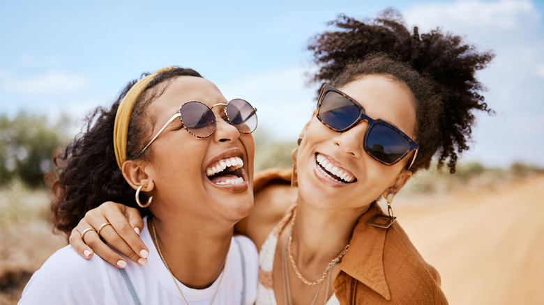 laughing hugging friends