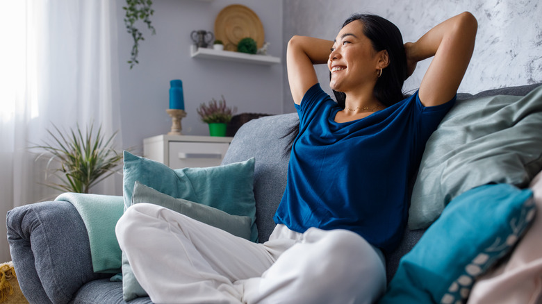 Woman sitting on couch