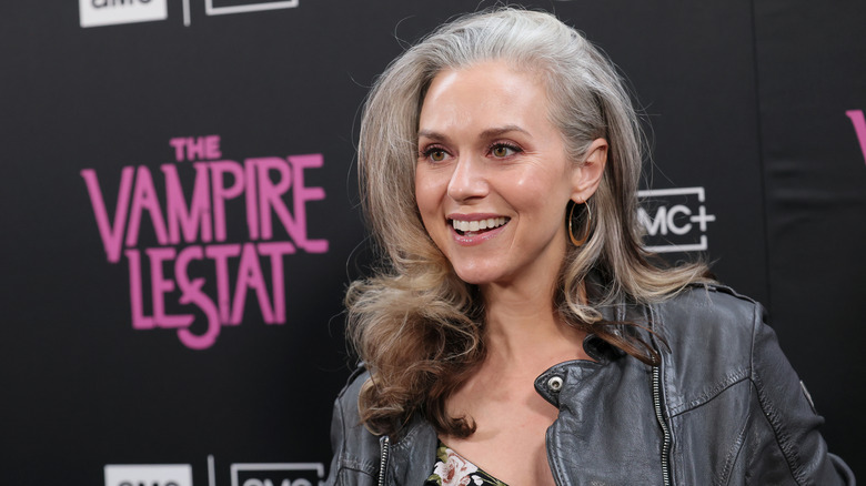 Hilarie Burton smiling in a black leather jacket at the premiere of The Vampire Lestat