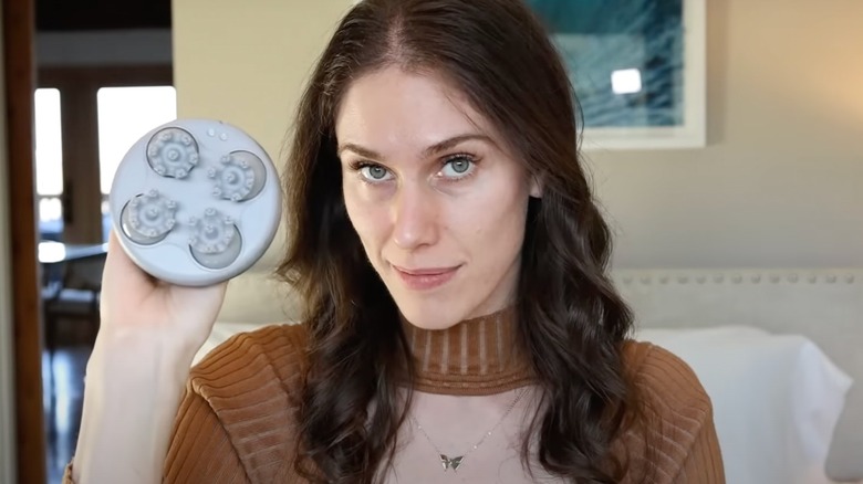 Woman holding a hair exfoliator