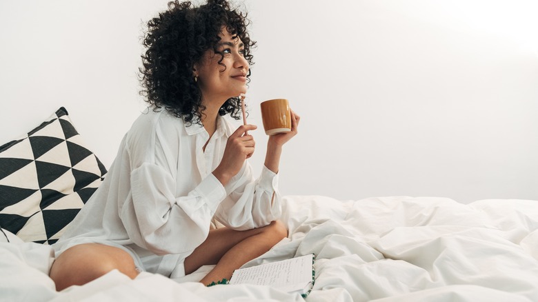 happy woman in bed