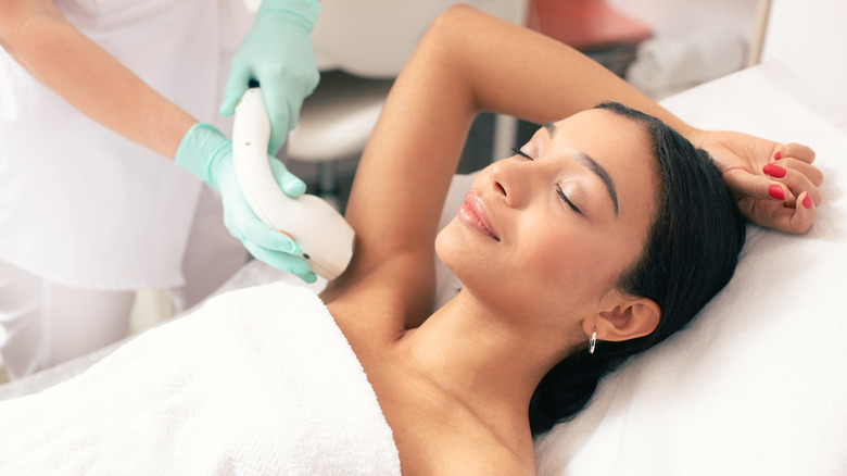 woman receiving laser hair removal