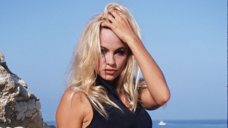 Pamela Anderson posing at the beach in the early '90s