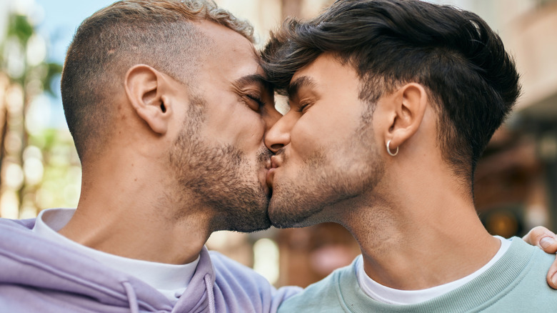 young gay couple kissing