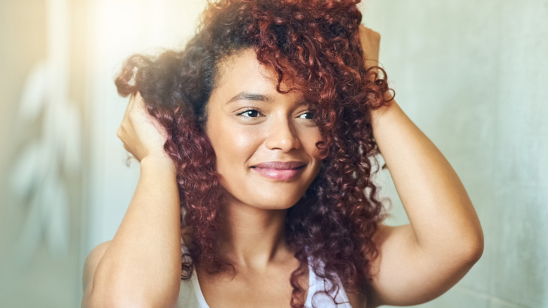 woman styling curls