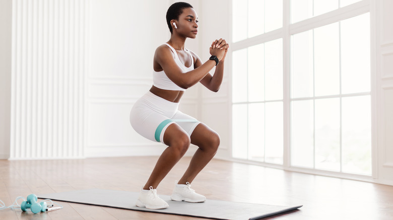 woman doing a squat 