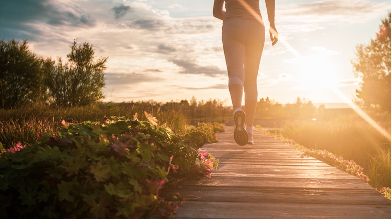 Woman walks outdoors