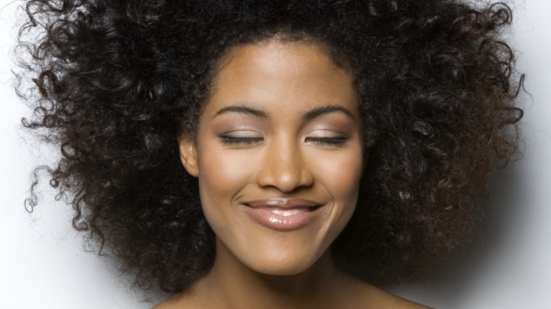 Woman with curls smiling
