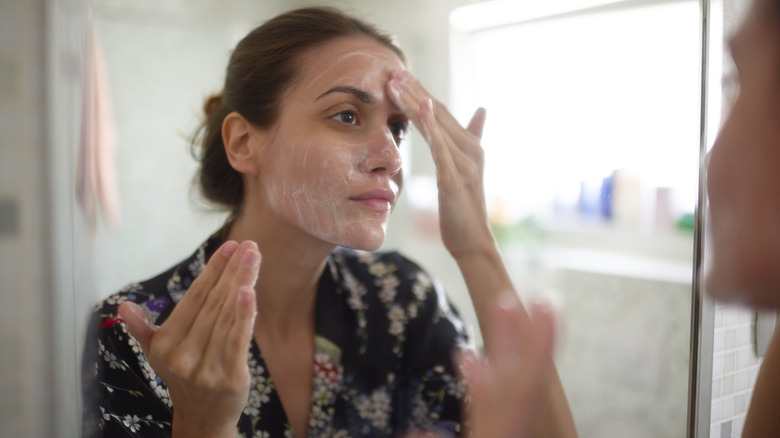 Woman washing her face