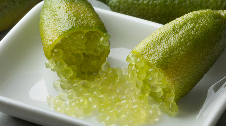 Halved caviar lime on a plate