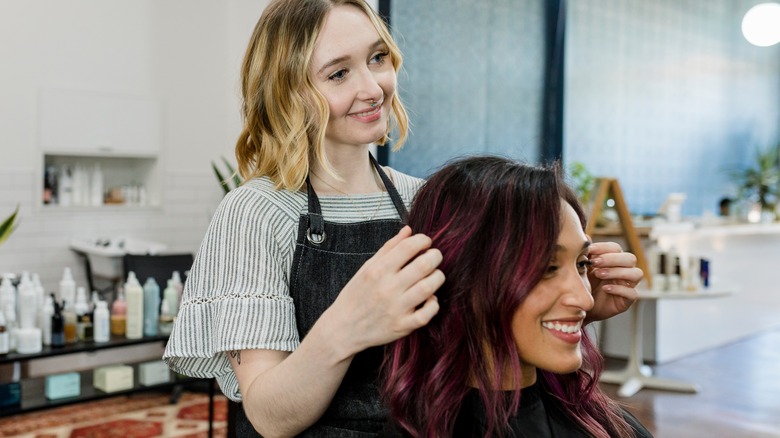 hairstylist giving a haircut