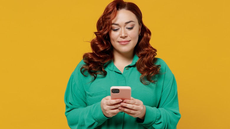 woman looking at phone