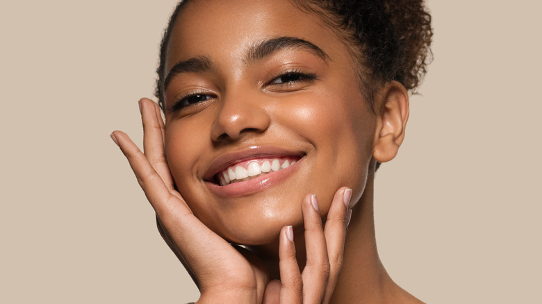 Beautiful young black woman smiling