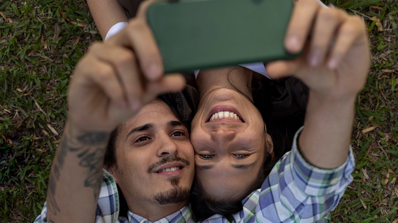 couple taking selfie smiling