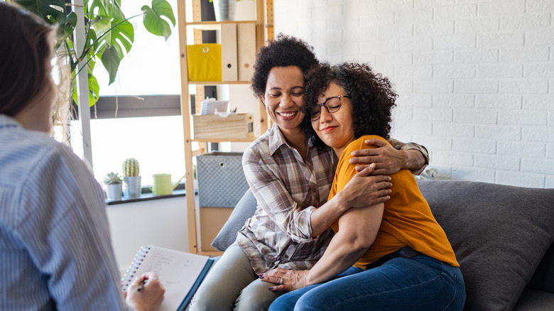 hugging couple in therapy session