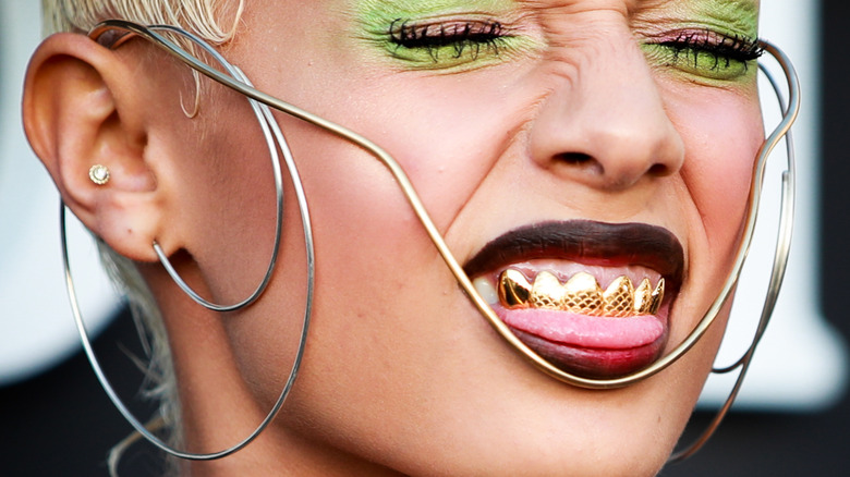 Jazelle wearing gold grills