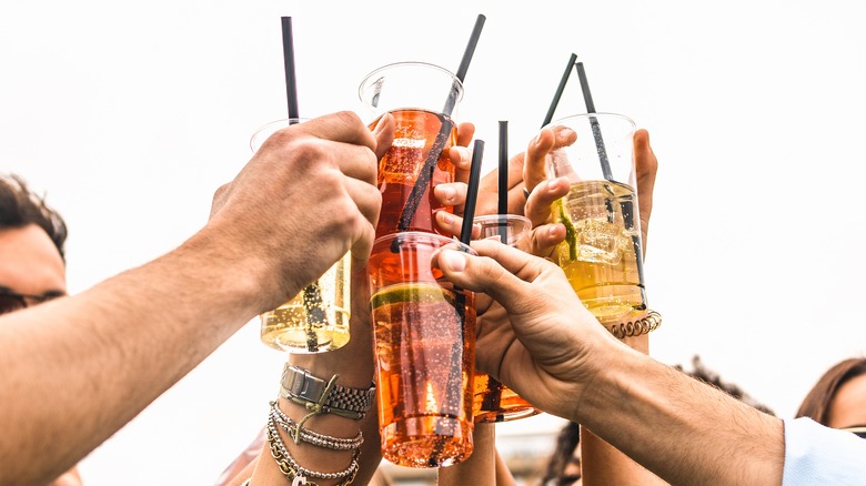 people holding drinks