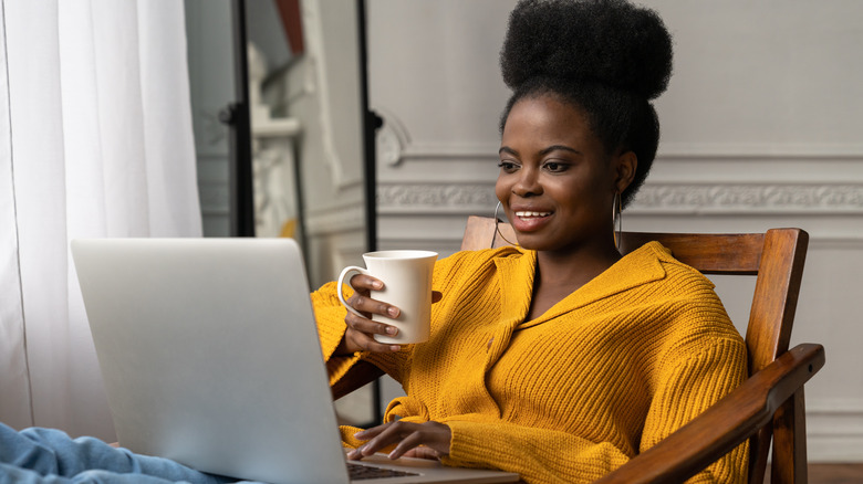 Girl in cardigan working