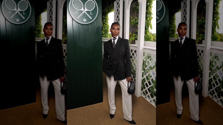 Michaela Coel wears a pinstriped blazer and white suit pants at Wimbledon 2026