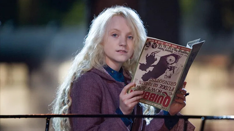 Luna Lovegood reading an upside down magazine