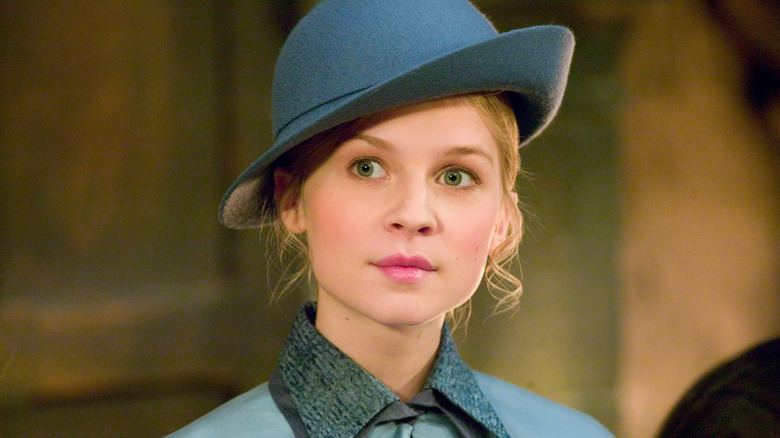 Fleur Delacour wearing a blue hat and coat